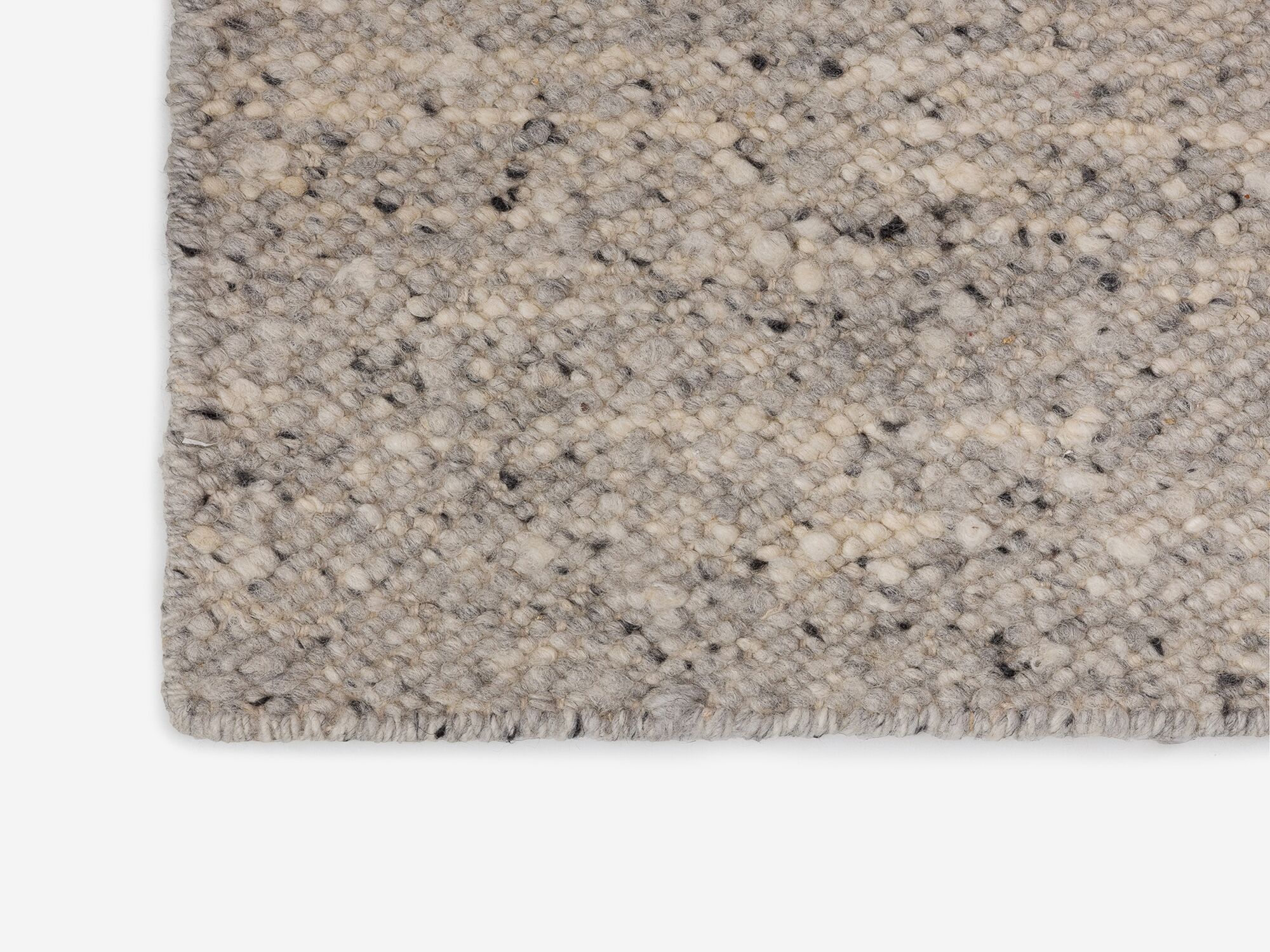 Detail view of large light grey area rug